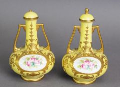 PAIR OF EARLY LATE NINETEENTH/ EARLY TWENTIETH CENTURY MINTONS PORCELAIN TWO HANDLED PEDESTAL
