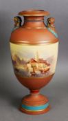 NINETEENTH CENTURY HAND PAINTED EARTHENWARE TWO HANDLED PEDESTAL VASE, heightened in blue and gilt