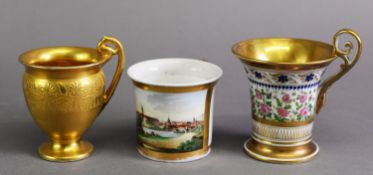 EARLY 20TH CENTURY BERLIN PORCELAIN GILT CABINET CUP, with raised anthemion decoration and gilt oval