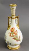 A ROYAL WORCESTER ALHAMBRA STYLE BLUSH IVORY VASE, with pierced handles and polychrome floral