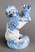 LATE 19TH CENTURY GALLE ST CLEMENT NANCY CANDLESTICK, modelled as a lion rampant holding a castle,