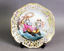 19TH CENTURY GERMAN PORCELAIN RETICULATED CABINET PLATE, the central hand-painted reserve
