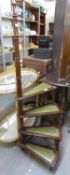 A SET OF LATE TWENTIETH CENTURY MAHOGANY AND GREEN TOOLED LEATHER INLAID SPIRAL LIBRARY STEPS,
