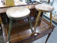 A NEAR PAIR OF VINTAGE THREE LEGGED MILKING STOOLS, 14" (36cm) high (2)