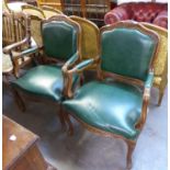 A PAIR OF MODERN WALNUTWOOD FRAMED FAUTEUIL OPEN ARMCHAIRS WITH GREEN LEATHER UPHOLSTERY (2)