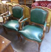 A PAIR OF MODERN WALNUTWOOD FRAMED FAUTEUIL OPEN ARMCHAIRS WITH GREEN LEATHER UPHOLSTERY (2)