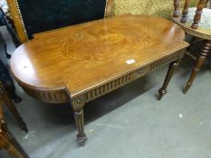 A LATE TWENTIETH CENTURY WALNUTWOOD COFFEE TABLE, WITH FLUTED APRON AND ON FLUTED TURNED TAPERING