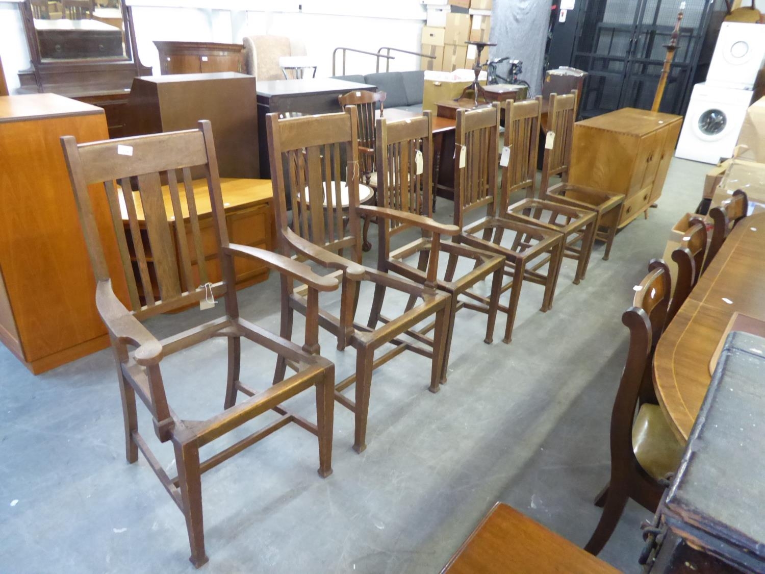 SET OF SIX OAK ARTS AND CRAFTS DINING CHAIRS, TO INCLUDE; TWO CARVER ARMCHAIRS AND FOUR SINGLE