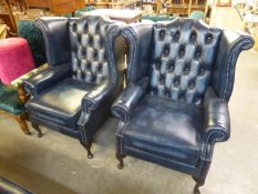 A PAIR OF MODERN BLUE LEATHER CHESTERFIELD WING ARMCHAIRS, ON CABRIOLE LEGS (2)