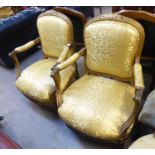 A PAIR OF NINETEENTH CENTURY GOLD COLOURED FRENCH FAUTEUIL OPEN ARMCHAIRS, WITH GOLD ARABESQUE