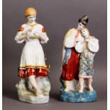 TWO MODERN RUSSIAN PORCELAIN FIGURES, one modelled as a couple in traditional dress, 10 ½” (26.