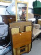 A PAIR OF MAHOGANY AND WICKER FOLD-AWAY THREE TIER BOOKCASES AND A FLOOR STANDING CHEVAL MIRROR (A.