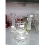 A HEAVY RUBY GLASS OVULAR BOWL, 10” LONG; A HEAVY CUT GLASS CIRCULAR NUT DISH; A CUT GLASS WATER
