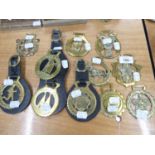 ELEVEN VARIOUS HORSE BRASSES LOOSE, AND ON LEATHER STRAPS (11)