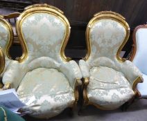 A PAIR OF FRENCH STYLE NINETEENTH CENTURY GOLD COLOURED ARMCHAIRS, IN SILVER COLOURED BROCADE