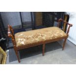 MODERN REPRODUCTION WILLIAM IV STYLE MAHOGANY WINDOW SEAT WITH SCROLL ARMS AND TURNED TAPERING LEGS,