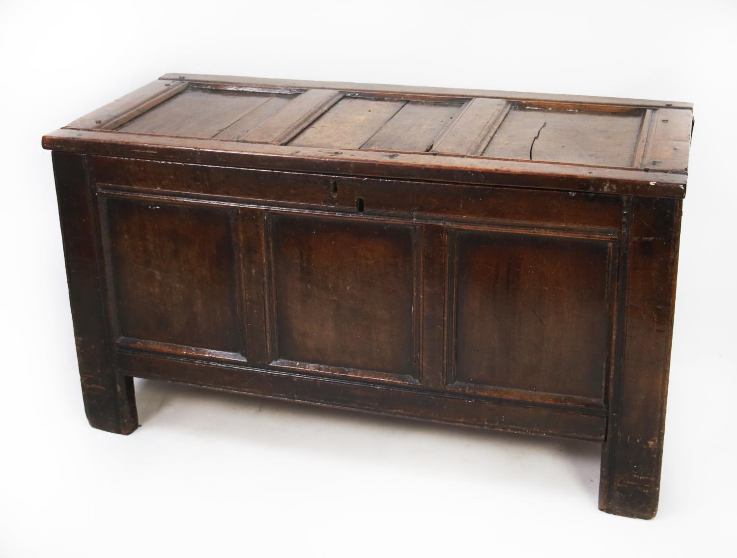 SEVENTEENTH CENTURY OAK COFFER, of typical form with three panelled top and front, 27” (68.6cm)