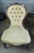 A VICTORIAN SPOON BACK NURSING CHAIR WITH BUTTON BACK, RAISED ON SHAPED FRONT LEGS
