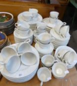 IN EXCESS OF ONE HUNDRED AND FIFTY PIECES OF WHITE POTTERY DINNER AND TEA WARES, PLATES AND CUPS,