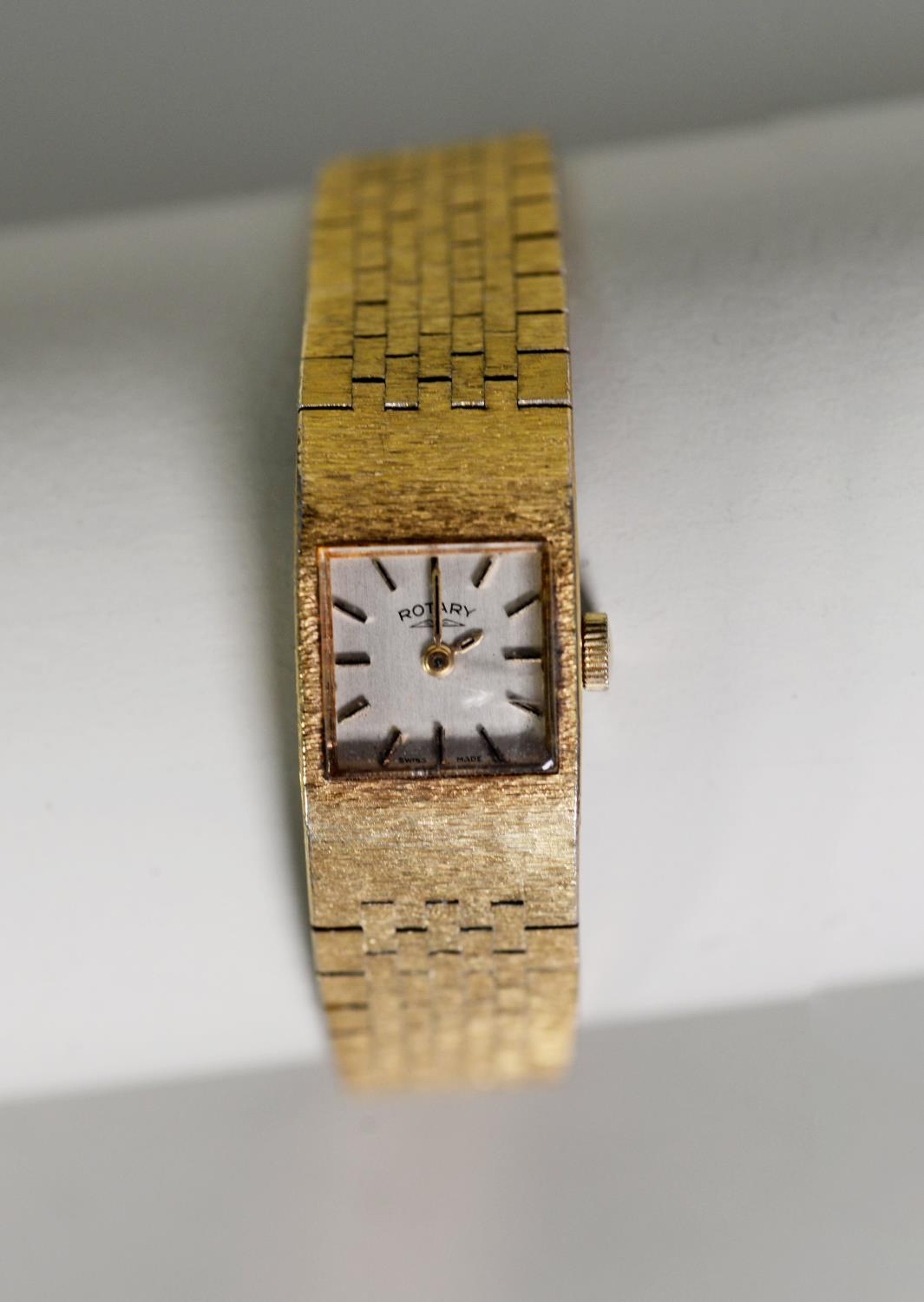 LADY'S ROTARY SWISS WRISTWATCH with mechanical movement, small square silvered dial with batons