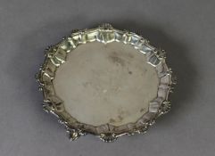GEORGE II ARMORIAL CRESTED SILVER WAITER, of typical form with shell capped moulded border and