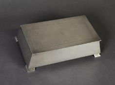 ART DECO STYLE WEIGHTED SILVER CLAD TABLE CIGARETTE BOX WITH ENGINE TURNED COVER, of tapering oblong