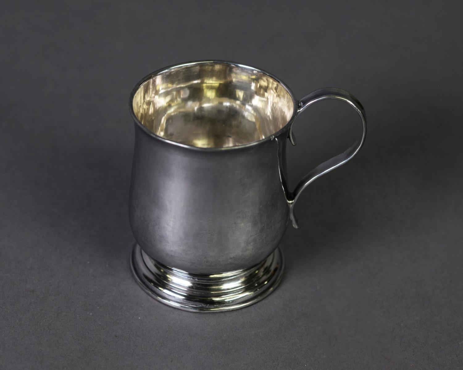 GEORGE II SILVER SMALL TANKARD BY J. GIBBONS, of footed baluster form with moulded base and high