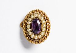 PINCHBECK OVAL BROOCH PENDANT, set with a centre oval amethyst and surround of seed pearls, a