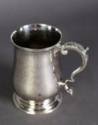 GEORGE III SILVER BALUSTER SHAPE MUG, with leaf-capped scroll handle, by John King, London 1771,