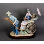 LLADRO, Spanish porcelain large group of a man pulling a rickshaw, with Geisha passenger holding a
