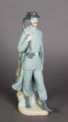 LLADRO, SPANISH PORCELAIN FIGURE OF A SPANISH POLICEMAN, modelled carrying a rifle over his right