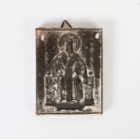 GREEK STAMPED METAL RELIGIOUS ICON depicting an enthroned saint with halo and Greek inscription, 3in