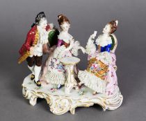 ITALIAN CAPO DI MONTE CHINA LACE GROUP of a courtier and two seated ladies round a small table, on