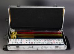 MAH JONG SET with bone and bamboo pieces, racks, etc., contained in a modern metal wheeled