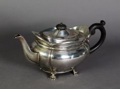 EDWARDIAN SILVER TEAPOT, of oval quatrelobate form, with blackwood handle and knop to the cover,