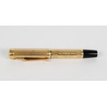 LADY'S 9ct GOLD AND BLACK PLASTIC SHORT FOUNTAIN PEN with engine turned decoration, 3 3/4in (9.