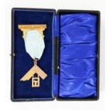 9ct GOLD MASONIC BADGE in the form of a set square and pendant, with presentation inscription from