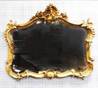 FRENCH 19TH CENTURY WALL MIRROR, landscape cartouche shaped with beveled edged plate, in carved