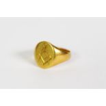 18ct GOLD SIGNET RING, the oval top engraved with a masonic symbol, Birmingham 1925, 6gms