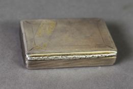 VICTORIAN SILVER SNUFF BOX, of oblong form with foliate thumbpiece, reeded sides and gilt