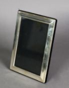 MODERN SILVER FRONTED DESK TOP PHOTOGRAPH FRAME, with black plush back and easel support, 7" x 5” (