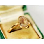 18ct GOLD RING collet set with an oval white stone, 3.6gms, ring size N