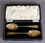 GEORGE III PAIR OF SILVER GILT BERRY SPOONS, 8 ½” (21.6cm) long, London 1805, maker’s mark: W B, 3.