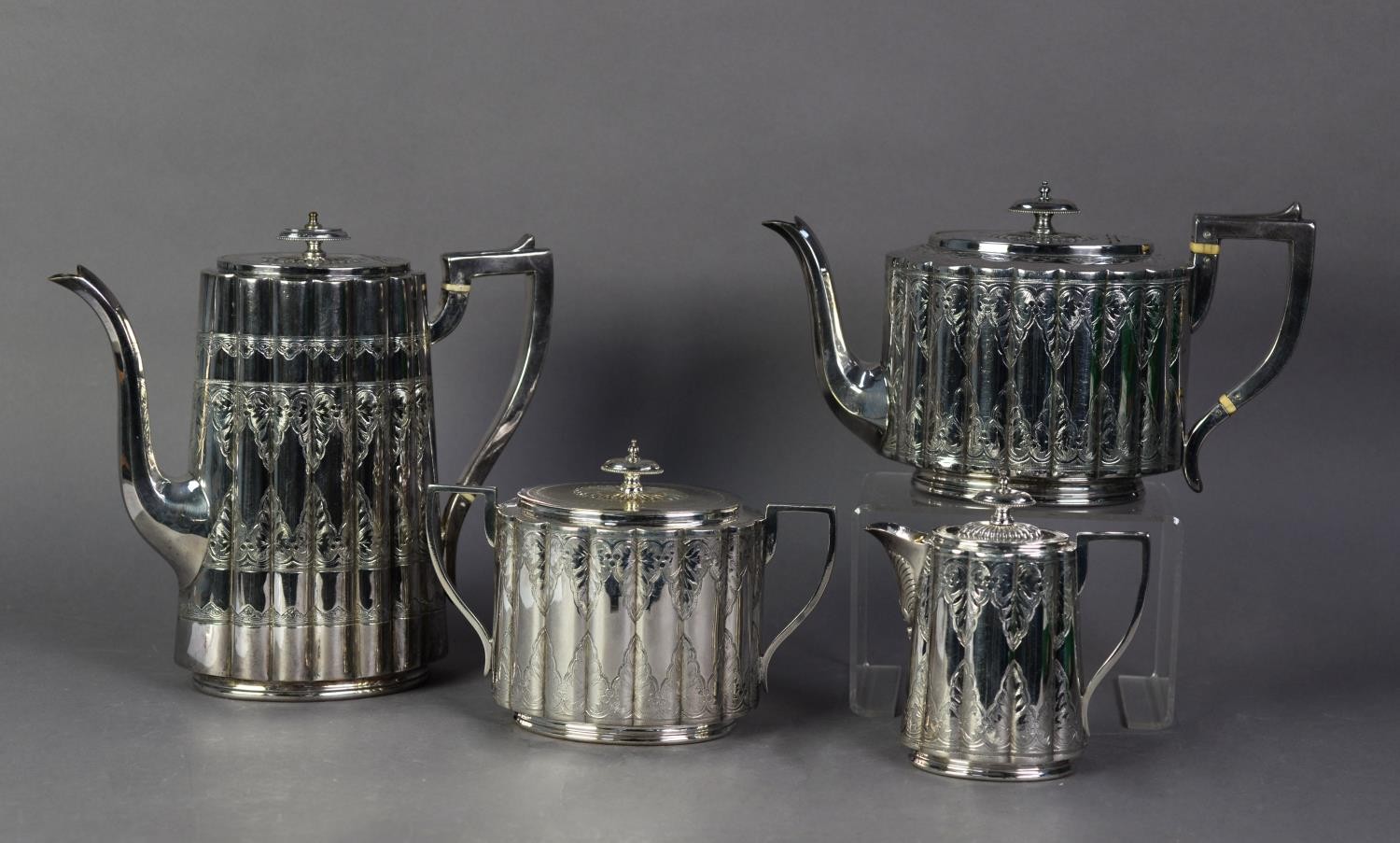 LATE VICTORIAN FOUR PIECE ELECTROPLATED TEA AND COFFEE SET, of oval lobated form with angular scroll