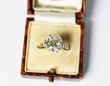 PLATINUM RING SET WITH A BRILLIANT FULL CUT SOLITAIRE DIAMOND, slightly cushion shaped,