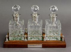 SET OF THREE SMALL, SQUARE SPIRIT DECANTERS AND STOPPERS WITH SILVER COLLARS, each, 6” (15.2cm)