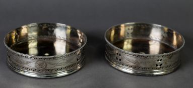 GEORGE III PAIR OF BRIGHT CUT AND PIERCED SILVER WINE COASTERS BY HESTER BATEMAN, of typical form