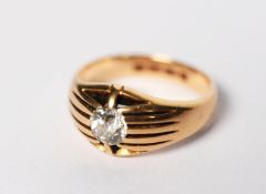 GENT'S 18ct GOLD RING WITH AN OLD CUT SOLITAIRE DIAMOND in an unusual setting of ten long claws