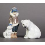 TWO LLADRO, SPANISH PORCELAIN FIGURES, one modelled as an ESKIMO BOY STANDING NEXT TO A SEATED POLAR