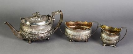 GEORGE III THREE PIECE EMBOSSED SILVER TEASET, of rounded oblong form with angular scroll handles,